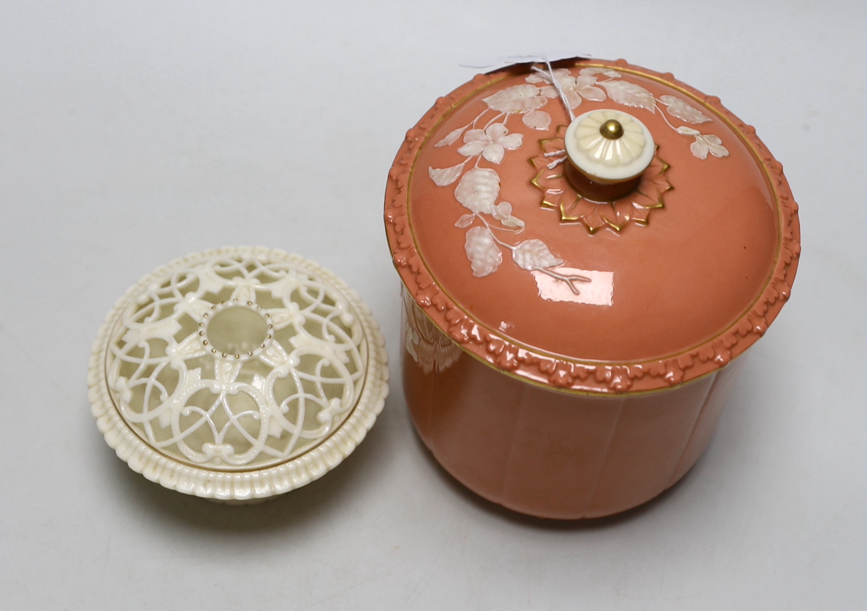 A Grainger’s or Locke Worcester pate-sur-pate jar and cover, the salmon ground decorated with white flowers and a Grainger’s white glaze and gilt pot pourri both c.1880, the largest 15cm high